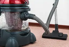 Commercial vacuum cleaner on a clean carpet