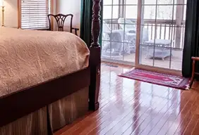 Clean and shiny hardwood floor in a bedroom